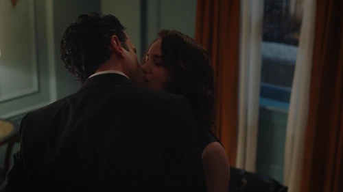 Midge and Lenny kissing.