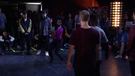 James (back to camera, hidden) watches Avril dance against West.