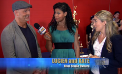 Kate watches in shock as Lucien tells Lisa Thompson that his studio is superior.