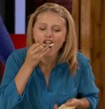 Upon a dare, Emily shoves crackers into her mouth.