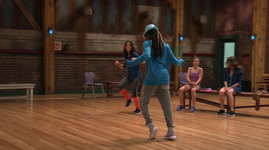 Amy (background) watches Sloane and Henry dance.