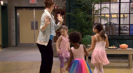 Chloe dances with the children.