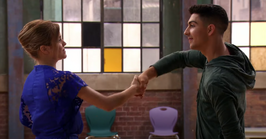 Riley and James shake hands.