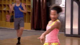 Michelle (background) watches Tiffany dance.