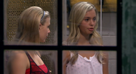 Emily watches Michelle as she claims that her group is ready to perform.