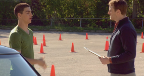 James talks to the driving instructor.