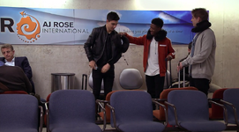 James declines the neck pillow that West attempts to give him.