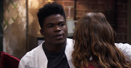 LaTroy tells Amy (back to camera) that he thinks his dad has changed.