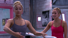 As she practices at the ballet barre, Richelle listens to Lola.