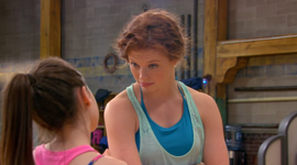 Becca (back to camera) is told by Giselle that she has to learn to bridge walk before she can run.