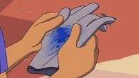 A glove smudged with blue Titan blood.