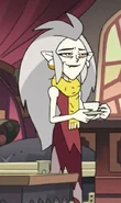 Eda wearing a yellow neckscarf in "Agony of a Witch".