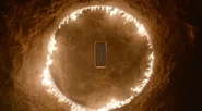 A circle of flame around the sarcophagus