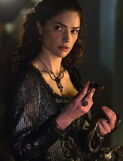 Mary holding a snake S1