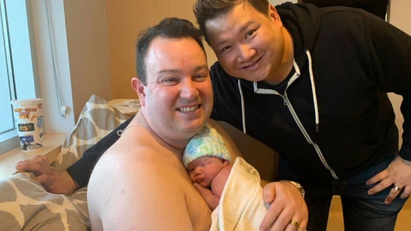 Married couple  and  with their newborn son Tyler. Photo source:[2].