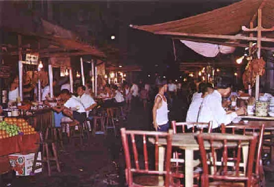 Roadside food vendors along the original Malabar Street in the evening.