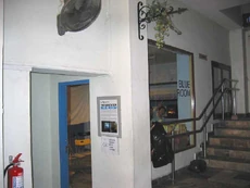 The Blue Room on the left, further down the lobby, where meetings are held.