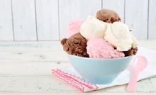 A bowl of chocolate, vanilla, and strawberry ice cream