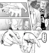 Tanaka cuts his palm with a knife
