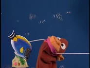 Jane pulling a string to reveal Ocean