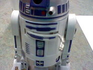 Artoo is reaching out to shock you before you can see him.