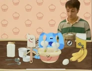 Blue put two eggs in bowl in Bakery