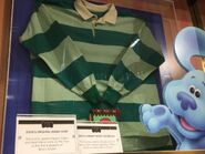 Steve's season 1 shirt and season 3 Notebook on display at FAO Schwarz