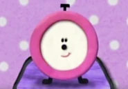 Tickety Tock without her arms, numbers, and bells.