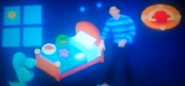 Josh wearing a blue striped shirt, black pants, and shoes