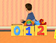 Numbers Everywhere!: Numbers 0, 1 and 2 were already pasted on three boxes where the stuffed dolls were in when Joe passes them. Also a pawprint wasn't seen on the number 0.