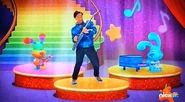 Josh Performing On Stage with Blue and Rainbow Puppy (Rock On, Rainbow Puppy!)