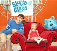 Promotional Picture of Joe, and Blue At Mall of America Having Fun with a Young fan Sitting on the Thinking Chair.