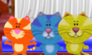 Blue Kitten dancing with Orange Kitten and Yellow Kitten.