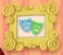 A pair of blue and green opera masks with scared faces.jpg