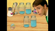 Mr Salt with a spoon tapping jars of water