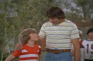 Bobby and Joe Namath play football after Joe Namath comes to visit.