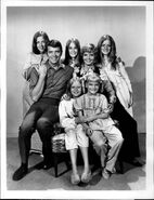 Promotional photo Top row: Karen Rietz, Robert Reed, Maureen McCormick, Florence Henderson, Barbara Bernstein Bottom row: Eve Plumb, Susan Olsen