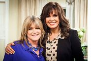 Reunited 37 years later: Susan Olsen and Marie Osmond on Hallmark talk show "Marie" in 2013.