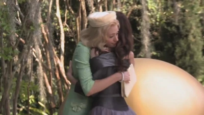 Ridley (as she was before her Claiming) and Lena sharing a hug.