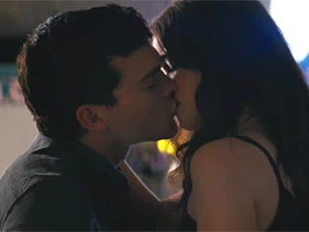 Ethan and Lena sharing a kiss.