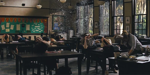 Lena shattering her classroom windows.