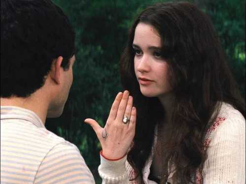 Lena has a tattoo on her hand that is counting down the days to her 16th birthday, when she will be claimed by either Light or Dark.