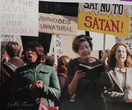 The townspeople branding Lena a witch