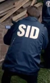 SID windbreaker worn by Buzz.