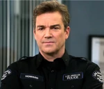 Howard in a Class B tactical uniform