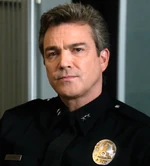 Acting Assistant Chief Howard (note the Deputy Chief's rank insignia but an Assistant Chief's badge)