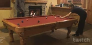 Seamus playing pool in the basement.