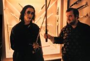 Alex and Brandon posing with swords