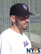 A white shirt with Mets on the front.