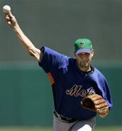 The St.Patrick's Day cap worn during Spring Training of 2009. It has the NY in black and orange black shadow drop. It is a two-tone cap with green on top and purple on bottom.